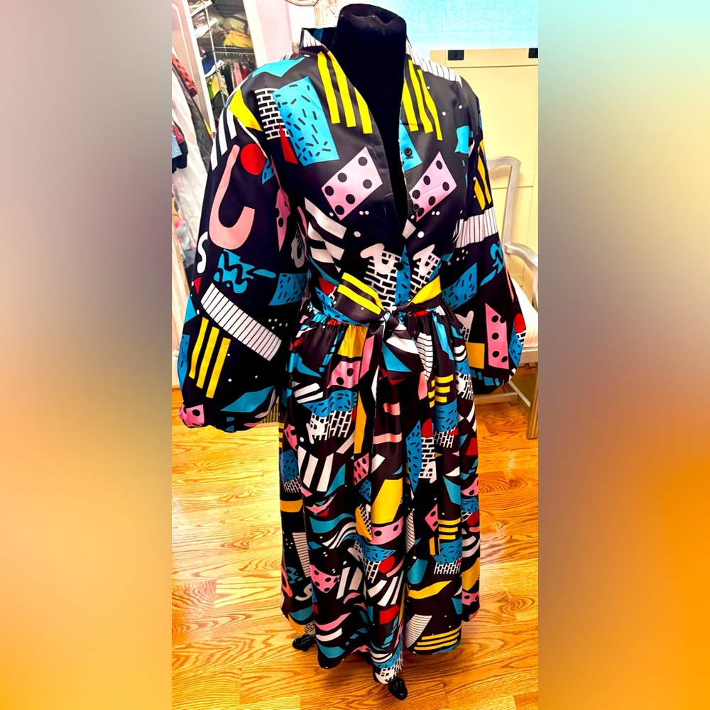 Delightful New never worn multicolor long swing dress with matching belt.